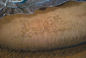 Sea Frame dessin sur le sable