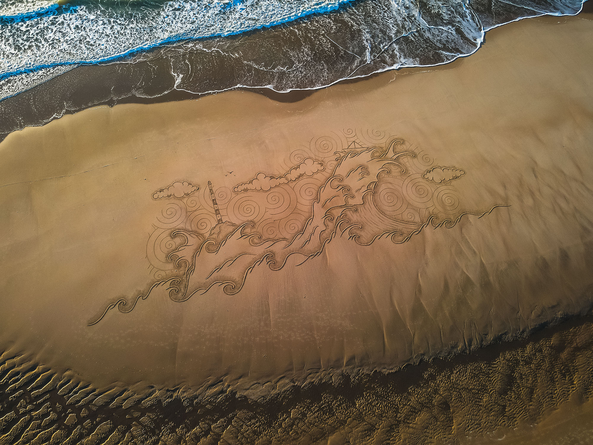 Le dessin sur le sable art effet mer par Jben